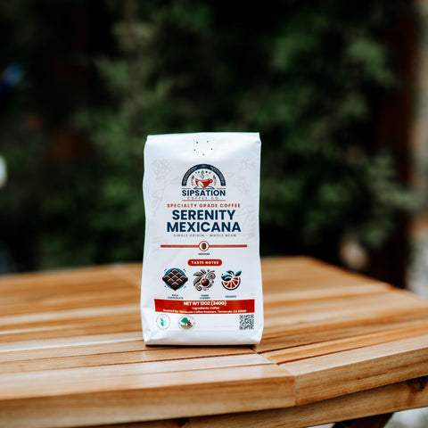 A bag of Serenity Mexicana coffee placed on a wooden table with a blurred background.